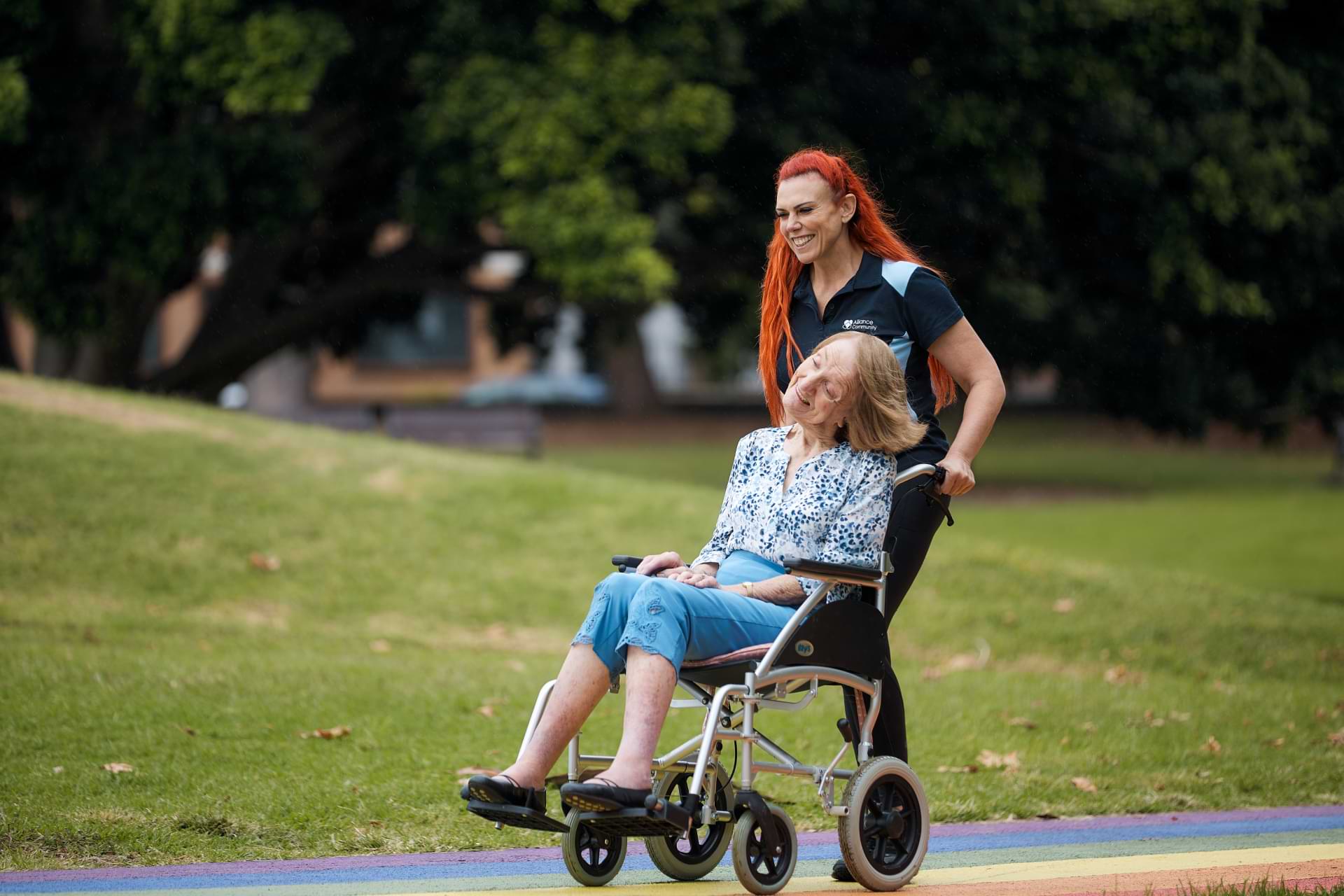 Woman pushing wheelchair